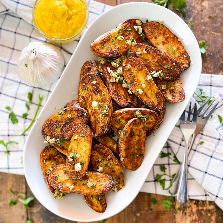 Extra Crispy Baked Garlic & Herb Potato Wedges - Baker by Nature